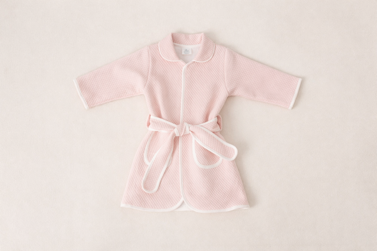 Pink Pima cotton kids bathrobe with white piping by Pipa & Pierre