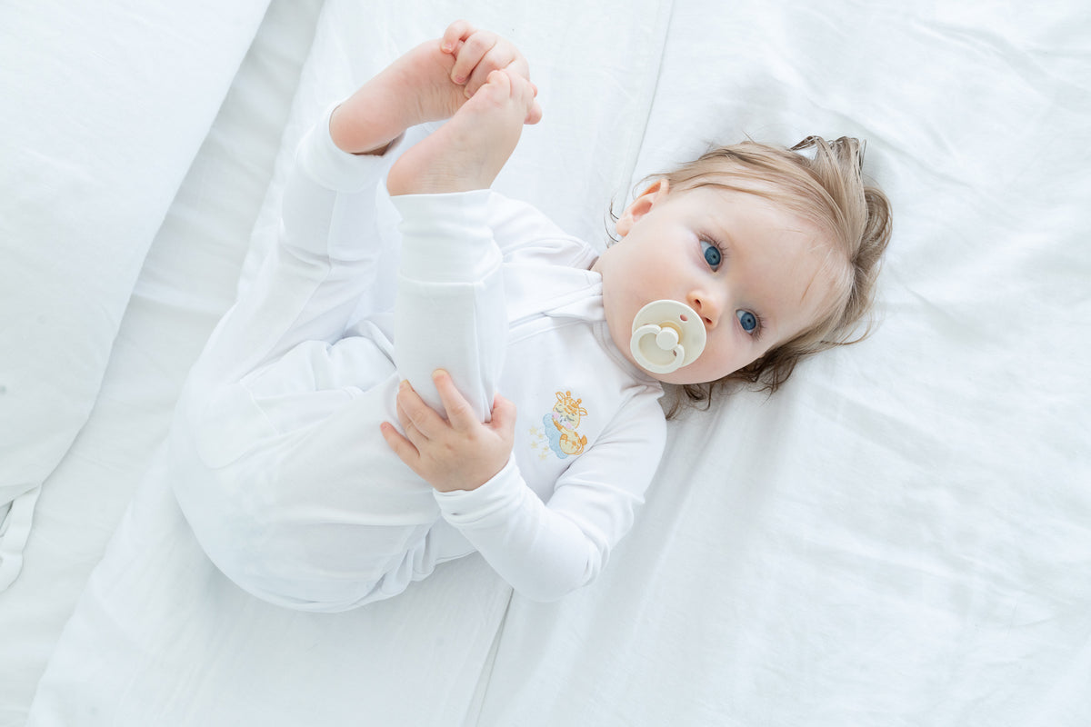 Double-zip Peruvian Pima cotton baby sleeper with giraffe and elephant embroidery by Pipa & Pierre